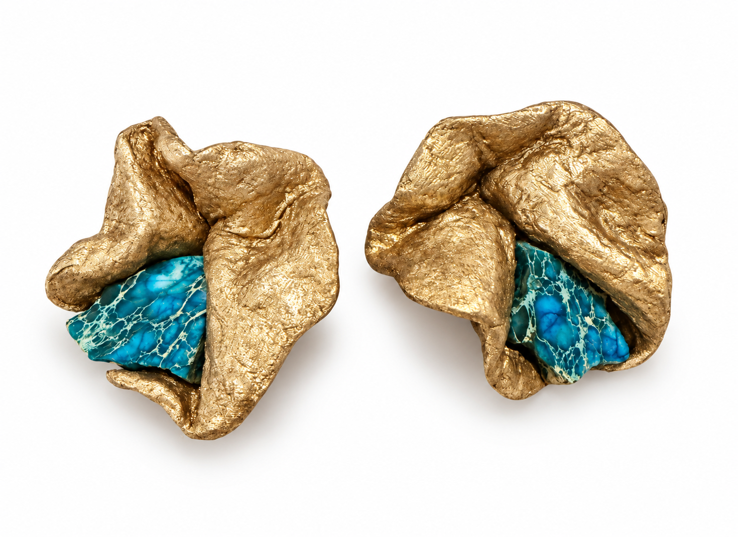 Pair of handmade sculptural gold-tone earrings with vivid turquoise marbled accents on a white background